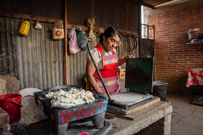 Pressing dough for tortillas, photo by Jalil Olmedo