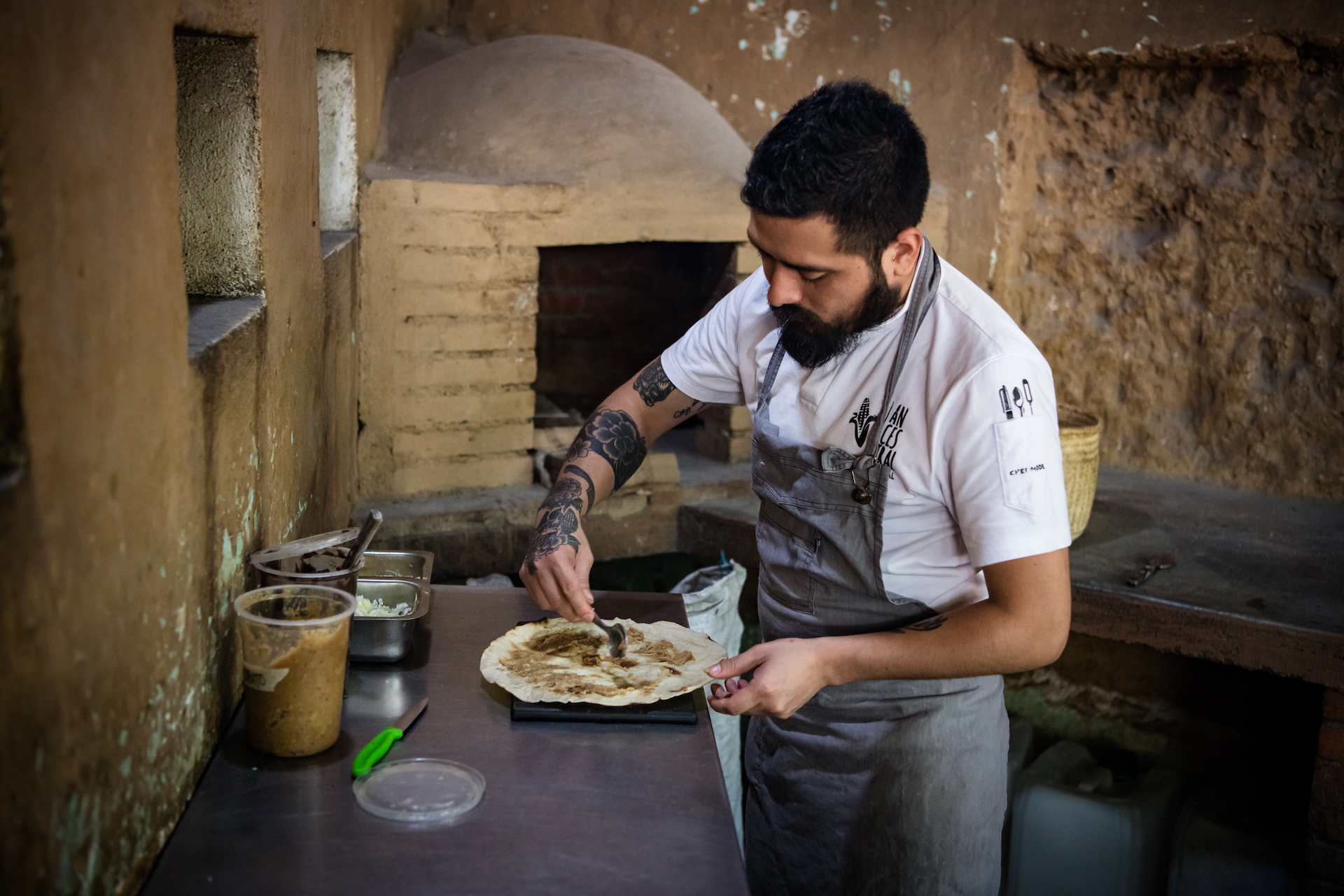 Making tlayudas at Ancestral in Oaxaca, photo by Jalil Olmedo